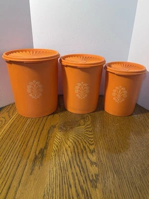 Set of 3 Vintage Orange Tupperware Servalier Nesting Canisters w/ Sunburst Lids - Image 1 of 4