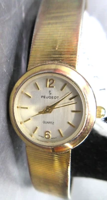 RELOJ PEUGEOT~738R CUARZO TONO ORO~8 1/4" LONGITUD EXTREMO A EXTREMO Foto 1 de 4