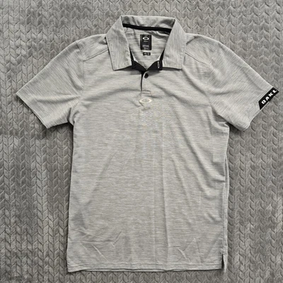 Camisa polo de golf Oakley para hombre pequeña gris jaspeado calce regular manga corta Foto 1 de 4