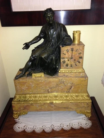 Table clock from the 19th century with French origin and Empire style Cover