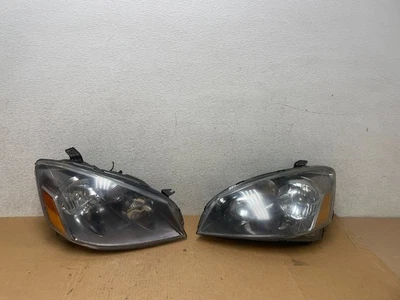 Juego de faros halógenos izquierda+derecha Nissan Altima 2005 a 2006 Q6731 DW Foto 1 de 4