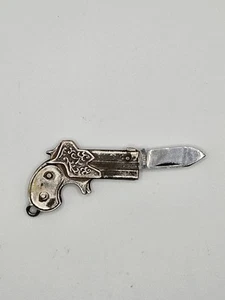 VINTAGE SILVER TONE REVOLVER GUN SHAPE TINY FOLDABLE KNIFE KEY CHAIN - Picture 1 of 8
