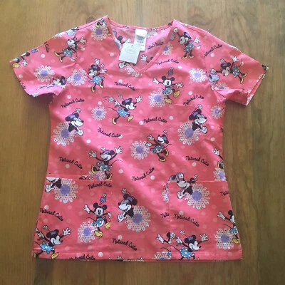 Disney Womens Size XS Minnie Mouse Pink Scrub Top Short Sleeve “Natural Cutie” - Image 1 of 4