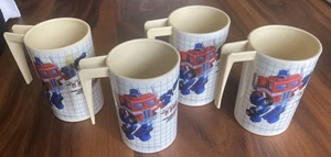 "Juego de 4 vasos de plástico vintage G1 Transformers con mango 1984 4"" de alto" - Imagen 1 de 10