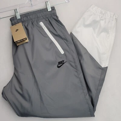 Pantalones de chándal Nike para hombre Windrunner tejidos de malla forrados talla L gris humo blanco Foto 1 de 4