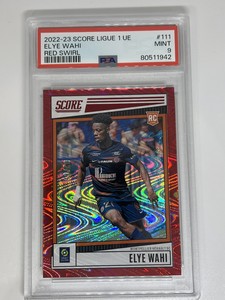 2022 Panini Score Ligue 1 Elye Wahi Red Swirl /65 Prizm Rookie PSA 9