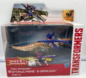 2014 Hasbro Transformers Race + Spark! Dino Sparkers Optimus Prime & GrimLock - Picture 1 of 2