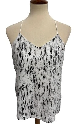 Blusa Express para mujer sin mangas blanca y negra a rayas cuello en V talla S Foto 1 de 4