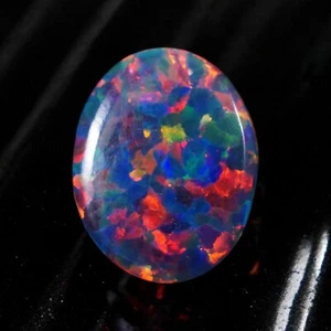 AAA+ Cabujón de ópalo de seda negro 15x11 mm 4,15 quilates piedra preciosa suelta al fuego - Imagen 1 de 6