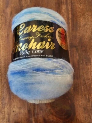 One cone of  Caress luxury 78% mohair/13% wool multi yarn full cone - Image 1 of 2