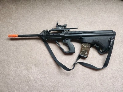 Airsoft AUG. Extra Mags, Drum Mag, Extra Batteries, Extra Gear - Image 1 of 3