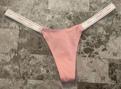 NUEVO CON ETIQUETAS BRAGAS TANGA VICTORIA'S SECRET ROSA BRILLO MICRO PEQUEÑO LOGOTIPO CORREAS LATERALES Foto 1 de 4