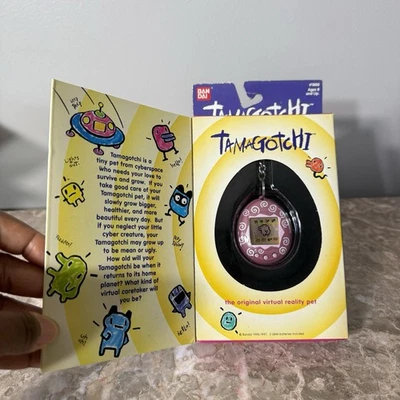 DE COLECCIÓN 1996-97 ORIGINAL #1800 BANDAI TAMAGOTCHI ROSA REMOLINO GEN 1 NUEVO Foto 1 de 4