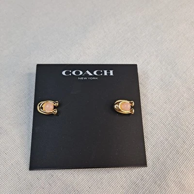 Aretes Coach Signature en C tono oro rosa Foto 1 de 4