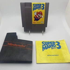 Super Mario Bros. 3 Nintendo NES cartridge Manual & Sleeve - Authentic Tested - Picture 1 of 12