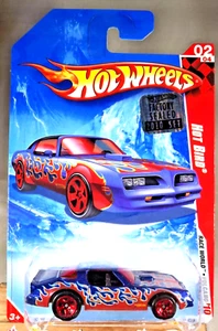 2010 Hot Wheels #219 Race World - Volcano 2/4 HOT BIRD blaue Variante mit roten 5 Speichen - Bild 1 von 5