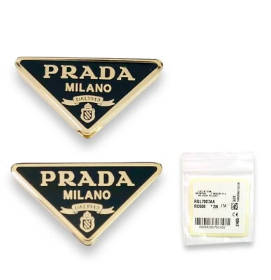 Prada 57YS 52ZV 59ZV 14YS 73ZS Dorado/Negro Repuesto Icono Logo Genuino Foto 1 de 4