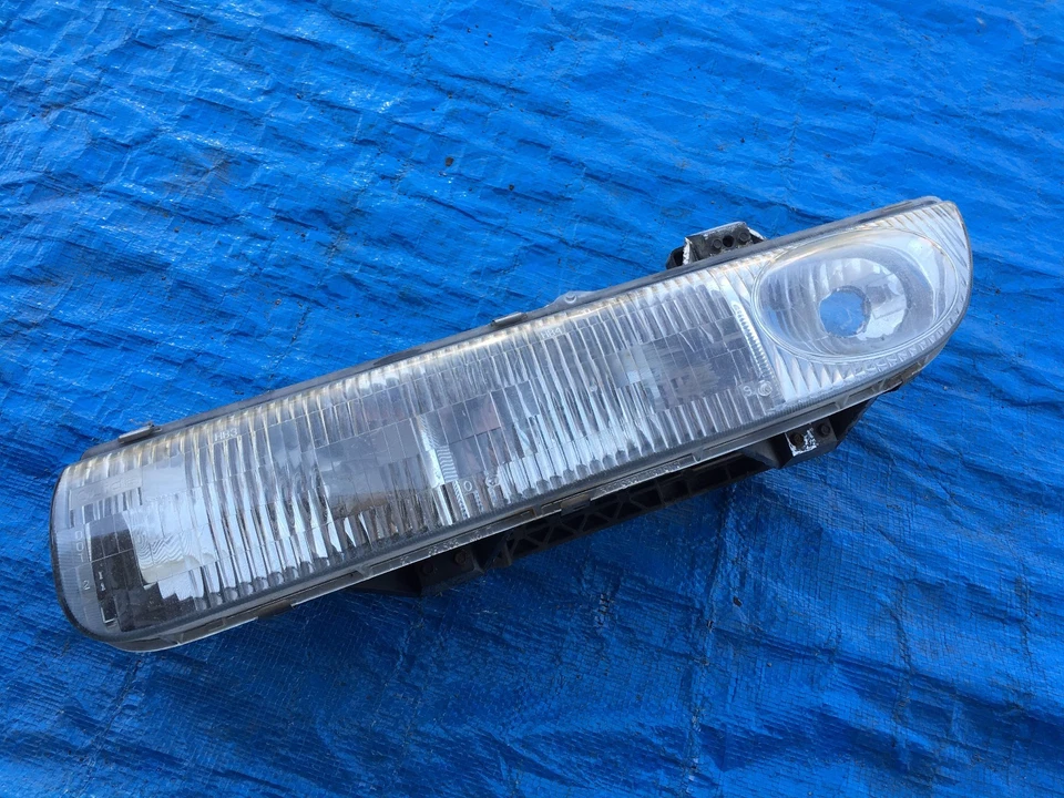 Faro izquierdo conductor Saturn serie S 1996-1999 sedán vagón OEM LUZ PRINCIPAL IZQUIERDA Foto 1 de 1