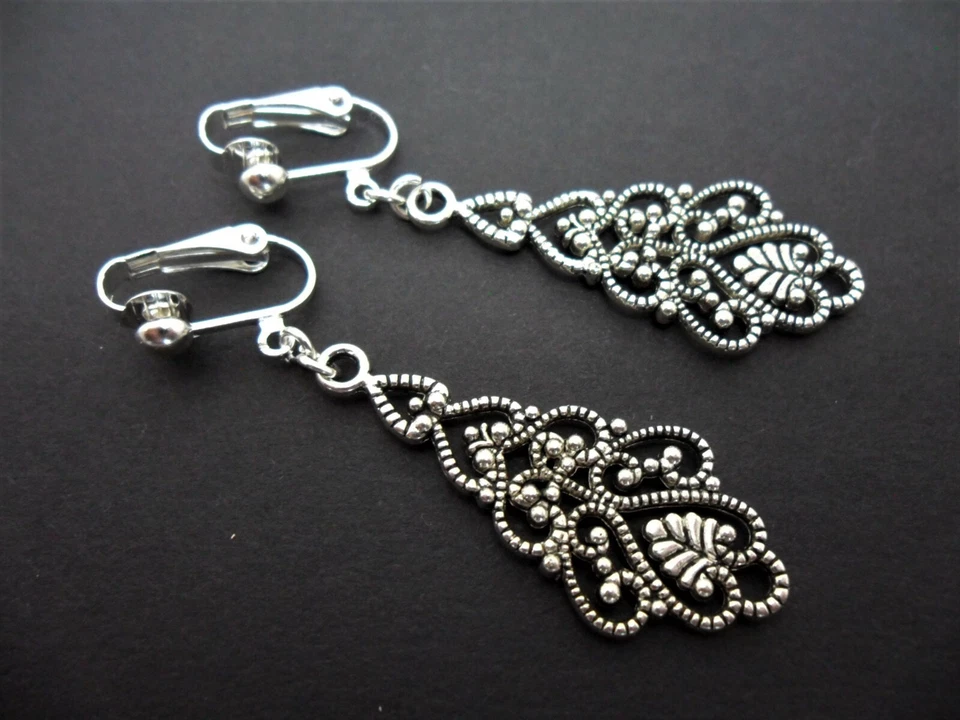 A PAIR OF TIBETAN SILVER  DANGLY FILIGREE CLIP ON EARRINGS. NEW.  - Image 1 of 1