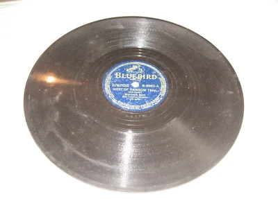 Montana Slim, Bluebird #B8983. West Of Rainbow Trail/Headin'...,78 rpm,10",VG+. - Image 1 of 2