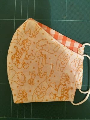 Máscara facial de tela blanca naranja Winnie The Pooh para adultos hecha a mano lavable Eyore 15 Foto 1 de 4
