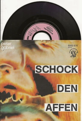 PETER GABRIEL SCHOCK DEN AFFEN SUNG IN GERMAN SINGLE + PIC SLEEVE, MINT, NEW - Image 1 of 2