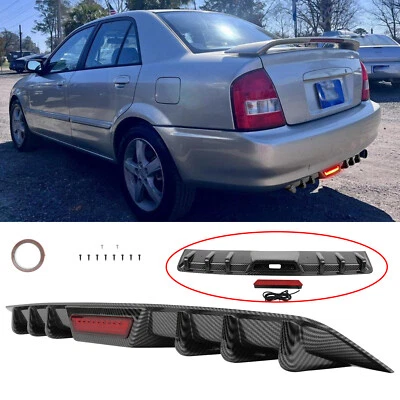 For Mazda Protege 1995-03 Carbon Fiber Rear Bumper Diffuser Spoiler w/ LED Light - Image 1 of 4