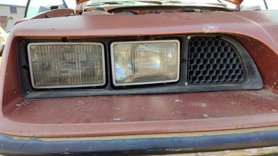 Pontiac Sunbird 1985-1987 pasajero faro derecho bisel OEM puerta envolvente Foto 1 de 4