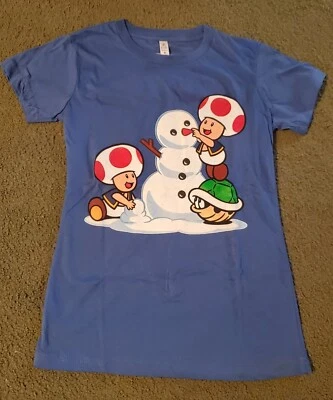 Camiseta Oficial Nintendo Talla S Mujer Azul Sapos Construcción Muñeco de Nieve Vacaciones NUEVA Foto 1 de 4