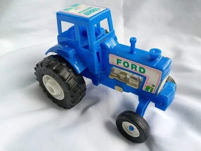 ---Vtg Processed Plastic Co blue Ford “Farm America” toy tractor – 8 inches long - Image 1 of 4