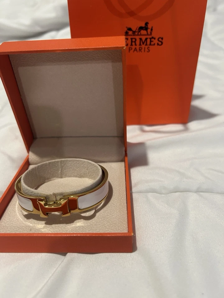 Brazalete brazalete Hermes Clic H dorado y blanco para mujer Foto 1 de 4