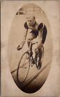 BICYCLE RACING, Man Riding a BIKE on a Track Real Photo Postcard