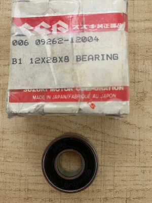 Cojinete de caja del cigüeñal Suzuki ALT125/185 NOS 12x28x8 parte # 09262-12004 NUEVO.  Foto 1 de 4