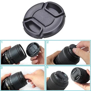 49mm Lens Cap center pinch snap on Front Cover string NEWDE- Nikon N5R3 - Picture 1 of 8