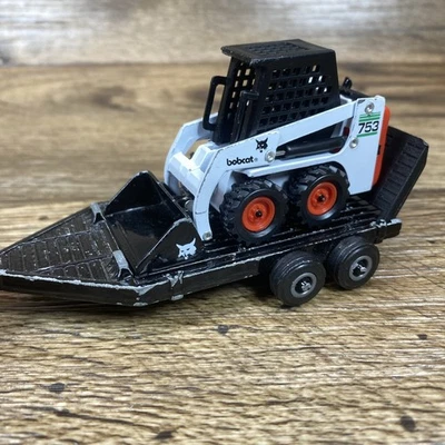 1:50 Ertl Diecast Bobcat 753 Skid Steer & Trailer Used Condition - Image 1 of 4