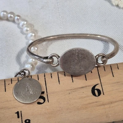 2 STERLING SILVER AND FRESHWATER PEARLS BRACELETS FOR BABY MONOGRAMED "A" - Image 1 of 4