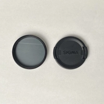 Sigma 55mm Lens Cap And Polarizing Filter - Image 1 of 4