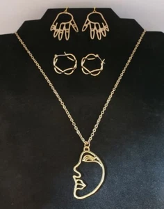 Gold tone face necklace 24"long chain plus 1 hand earrings and hoop set. - Picture 1 of 5