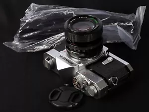 Konica Autoreflex T Mechanical 35mm Film SLR c/w 28-50mm f/3.5-4.5 Zoom Lens Kit - Picture 1 of 11