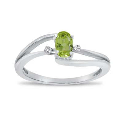 14k White Gold Oval Peridot And Diamond Wave Ring - Image 1 of 4