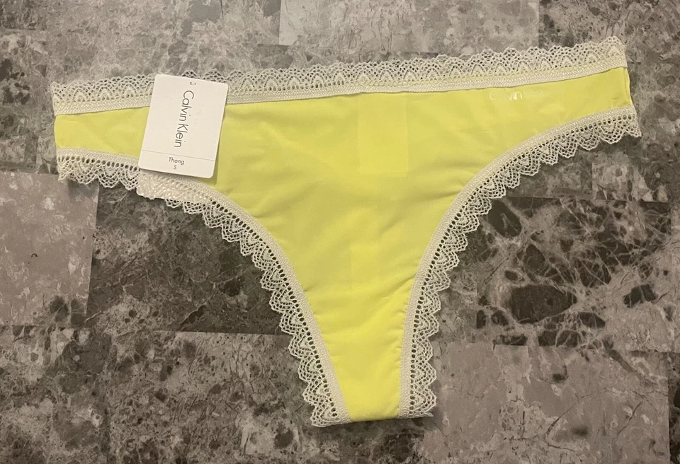 BRAGAS TANGA FINAS CALVIN KLEIN PEQUEÑAS LISAS AMARILLAS ENCAJE NUEVAS CON ETIQUETAS Foto 1 de 4