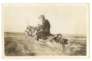 RPPC EXAGGERATION Conard 49 - MAN Rides GIANT GRASSHOPPER ca1930s - Picture 1 of 2