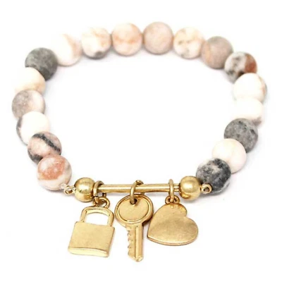 Pulsera elástica de cuarzo con dije de corazón de cerradura y llave de cobre Foto 1 de 4