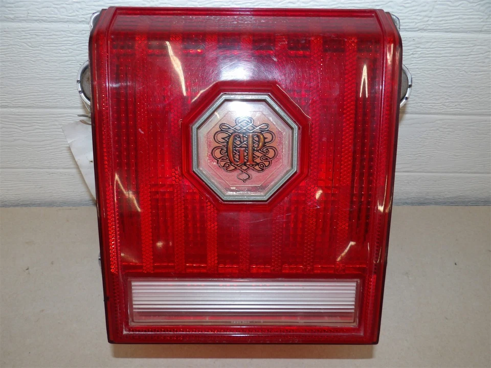 RH PASSENGER SIDE TAILLIGHT LAMP PONTIAC GRAND PRIX 1977 CHROME OEM - Image 1 of 3