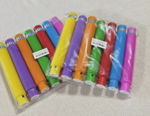 2 Pkgs à 7 Stück Leuchtende LED Pop Röhren für Kinder Party, Fidget Spielzeug ab 4+, NEU - Bild 1 von 2