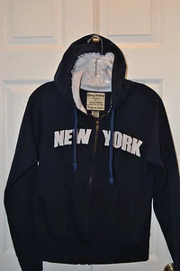 NUEVA SUDADERA CON CAPUCHA DELANTERA CON CREMALLERA AZUL MARINO "NUEVA YORK". TALLA XL NIÑOS - Imagen 1 de 3