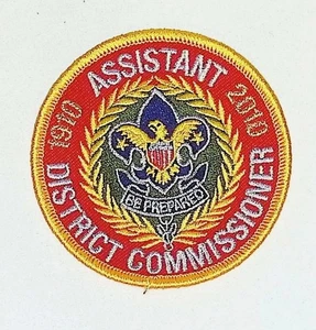BSA Assistant District Commissioner Position Patch 2010 Red Gold Embroidered - Picture 1 of 3
