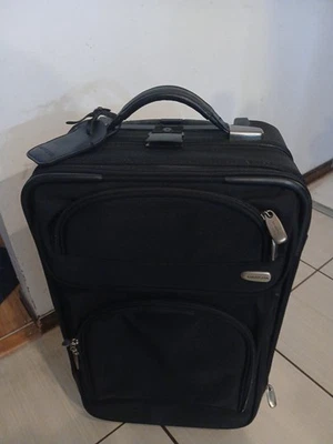 DAKOTA BY TUMI CARRYON +SUITCASE GARMENT EXPANDABLE WHEELED BLK- GUC - Image 1 of 4