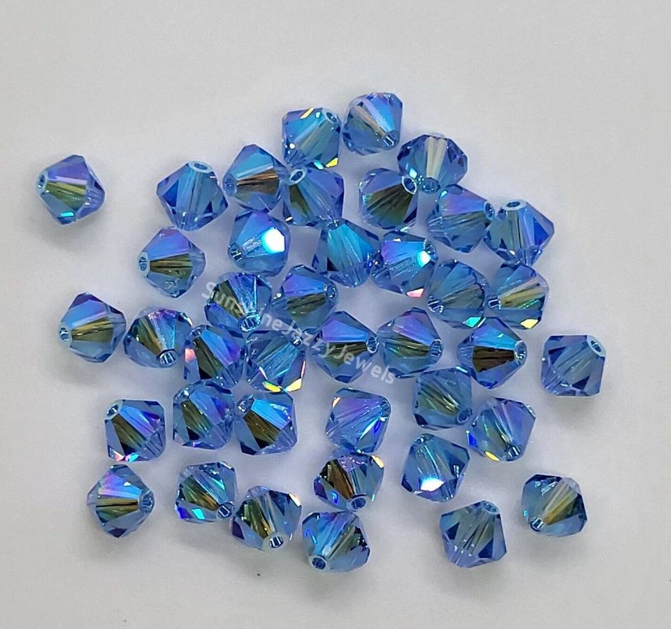 12pc Swarovski Crystal Light Sapphire AB2X 6mm Bicone 5328 Beads - Image 1 of 1