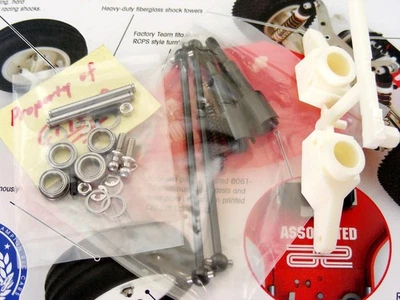 Team Associated RC10T Cliff Lett Rear Wheel Hubs Drive Axles Dog Bones Bearings - Image 1 of 4